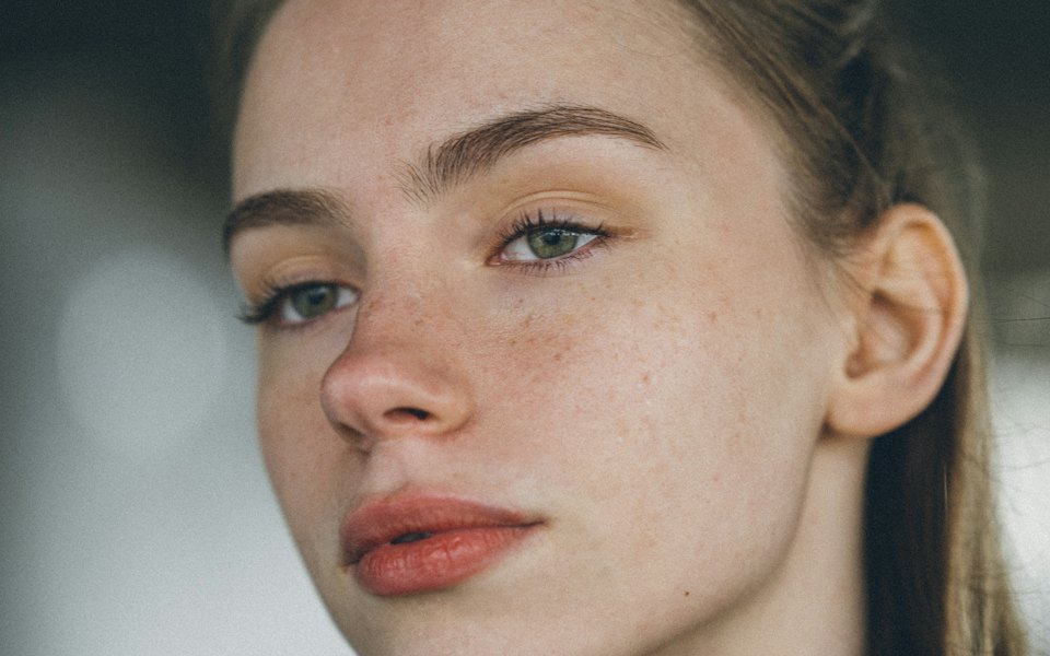 Close portrait of a woman with natural, healthy skin